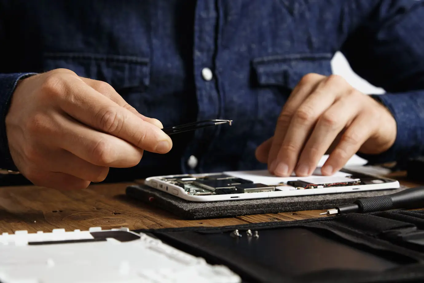 Close-up of an iPhone repair workstation